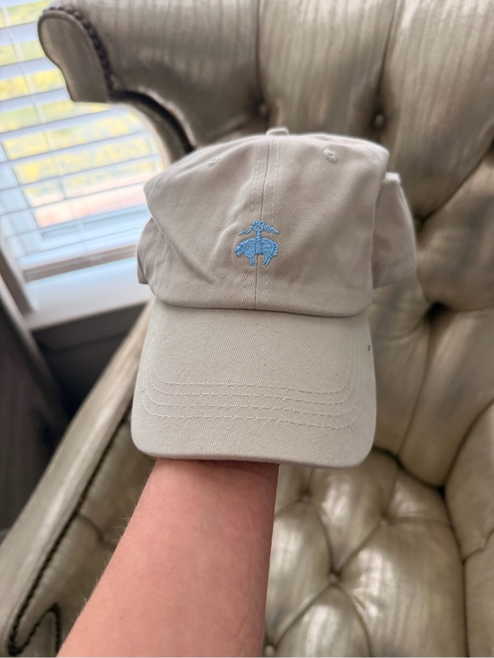 Brooks beige cap with light blue embroidered logo